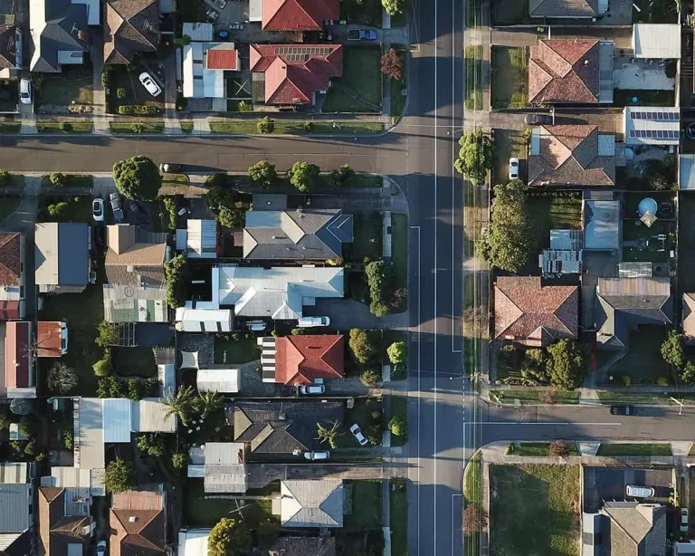 An aerial view of suburban streets and houses