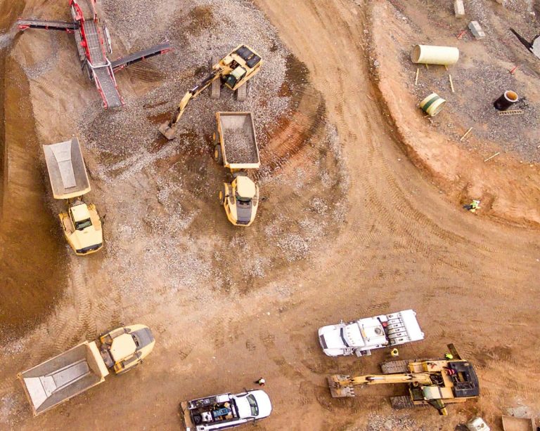 Aerial view of mining vehicles in a mining site